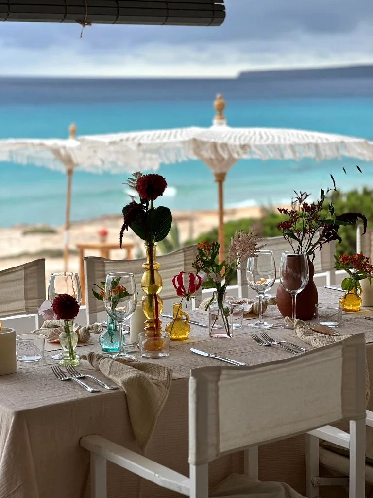 Floral styling under beach umbrellas at 10.7