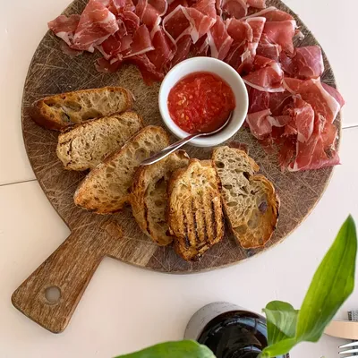 Mediterranean charcuterie board with fresh bread